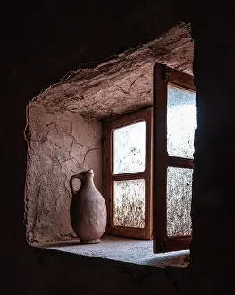 Old clay pot on a window ledge inside 17th century Kasbah Amridil, Skoura, Morocco