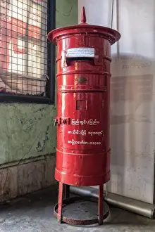 Post Office Prints: Old colonial style red letterbox in post office in Yangon, Myanmar