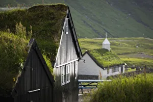 The old Duvugarðar farm and the church of Saksun. Stryemoy, Faroe Islands