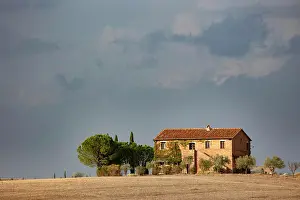 Stormy Sky Prints: Old farmhouse and stormy sky, Val d'Orcia, Tuscany, Italy