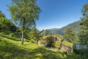 Scandinavian Culture Prints: Old farms and huts with grass roof on shore of lake Jolstravatnet, Astruptunet, Jolster