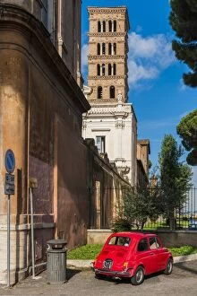 Images Dated 10th October 2016: Old Fiat 500 car parked with Basilica dei Santi Bonifacio ed Alessio in the background