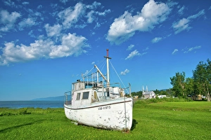 Industry Prints: Old fishing boat on shore of St. Lawrence River, Quebec, Canada