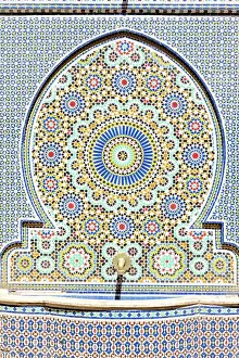 Ceramic Prints: Old fountain fully decorated with ancient mosaic tiles in the historical Bahia Palace