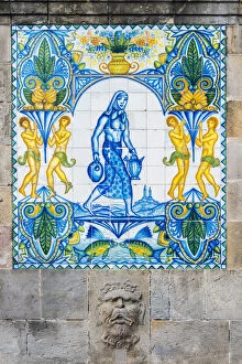 Detail of the old Fuente de Santa Anna fountain with decorated tiles in Barrio Gotico
