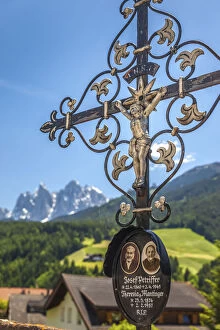 Old grave cross in the cemetery of St. Peter in Villnöss Valley, South Tyrol