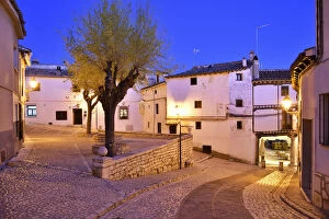 The old houses dating back to the 15 th century at the Plaza Mayor of Chinchon at dusk