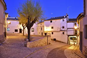 The old houses dating back to the 15 th century at the Plaza Mayor of Chinchon at dusk