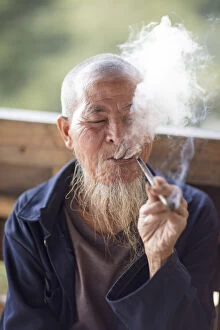 Images Dated 16th April 2021: Old man smoking pipe, Longji, Longshen, Guangxi, China