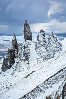 Bleak Prints: Old Man of Storr and snow covered landscape
