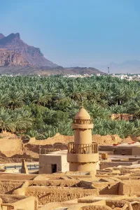 Mosque Prints: Old mosque minaret, Date palms and old town ruins in the Oasis of Al-Ula