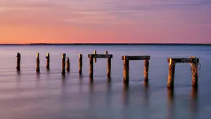 Dock Prints: Old pier pillars at sunrise on Cape Cod, Falmouth Heights, Massachusetts, USA