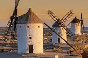 Images Dated 26th August 2021: Old Spanish windmills at sunrise, Consuegra, Castilla-La Mancha, Spain