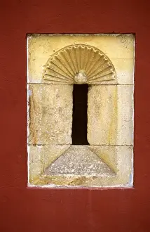 Architectural Detail Prints: An old stone alcove is framed by a red painted wall in a mansion in Llanes