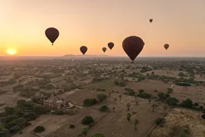 Old temple in Bagan and hot-air balloons at sunrise, UNESCO, Old Bagan, Mandalay Region