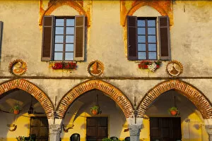 Old Town Building Facade illuminated at sunrise, Arona, Lake Maggiore, Piedmont, Italy