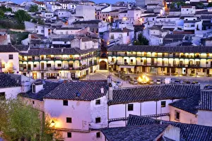 The old town of Chinchon with the 15-17th century Plaza Mayor at dusk. Castilla la Mancha