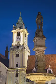 Old Town Hall and Rolands Fountain in Hlavne Nam (Main Square) at dusk