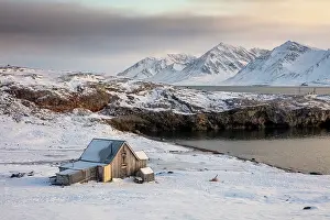 Svalbard Prints: Old wooden cabin in stunning Arctic landscape