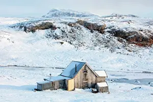 Svalbard Prints: Old wooden cabin in stunning Arctic landscape
