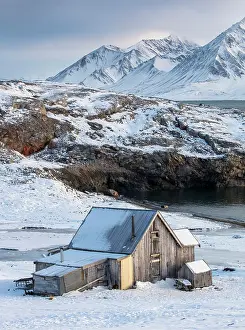 Svalbard Prints: Old wooden cabin in stunning Arctic landscape