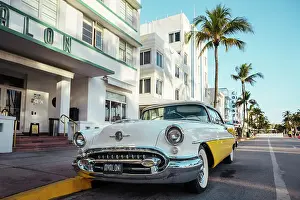 Automobile Prints: Oldsmobile Super 88 convertible parked in front of the Avalon Hotel