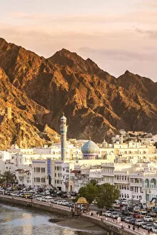 Oman Collection: Oman, Muscat. Cityscape of Mutrah old town, elevated view, at sunset