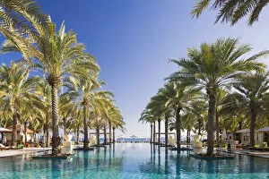 Images Dated 14th December 2015: Oman. Muscat Governorate, Muscat. The 50 metre infinity pool at the Ritz Carlton Al