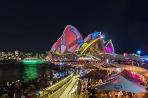 Opera Bar and Sydney Opera House illuminated with projections during Vivid Sydney