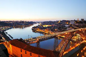 Oporto, capital of the Port wine, with the Douro river and Dom Luis bridge at sunset