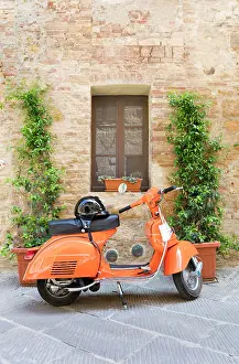 Scooter Prints: Orange moped against old building, San Quirico d'Orcia, Tuscany, Italy
