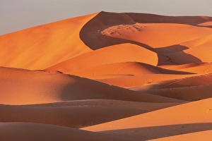 Erg Chebbi Prints: Orange sand dunes at sunset, Erg Chebbi, Sahara Desert, near Merzouga, Morocco