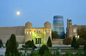 Silk Route Collection: Ota Darvoza, the western gate to the old town of Khiva, at dusk. In the right side