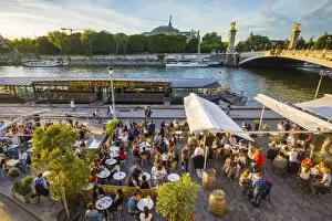 Outdoor cafe / restaurant by the River Seine & Pont Alexandre III, Paris, France