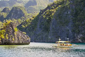 Calamianes Prints: Outrigger boat anchored at Twin Peaks Reef off the coast of Coron Island, Coron, Palawan