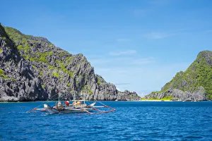 Province Of Palawan Prints: Outrigger boat passing Tapiutan Island, El Nido, Palawan, Philippines