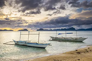 Province Of Palawan Prints: Outrigger boats at sunset on Dolarog Beach, El Nido, Palawan, Philippines