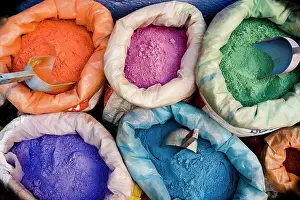 Market Stall Prints: Overhead view of colored powders for textile dyes in the street markets, Morocco