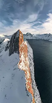 Mountain Peak Prints: Overhead view of steep ridge of Segla mountain covered with snow at sunset
