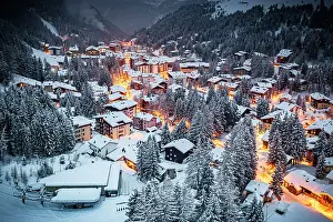 Rooftop Prints: Overhead view of traditional snowy huts in the alpine village of Madesimo at dusk