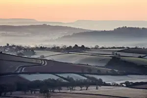 Silverton Prints: Overlooking frost and mist covered countryside at dawn near the village of Silverton