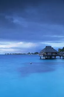 Images Dated 30th July 2015: Overwater bungalows of Le Maitai Hotel and Intercontinental Bora Bora Le Moana Resort at dawn