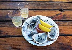 Harbours Prints: Oysters and wine, a traditional lunch combination in Whitstable, Kent, England