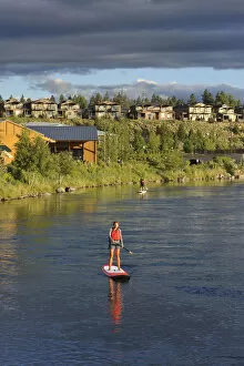 Paddle boarding on the Deschutes river, Old Mill district, Bend, Central Oregon, USA
