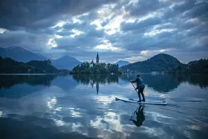 Images Dated 12th May 2021: Paddle boarding, Lake Bled, Slovenia