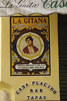 Painted ceramic mural at the entrance to a tapas bar