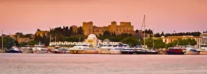 Palace of the Grand Masters & Mandraki Harbour illuminated at dawn, Rhodes Town, Rhodes