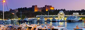 Palace of the Grand Masters & Mandraki Harbour illuminated at dusk, Rhodes Town, Rhodes