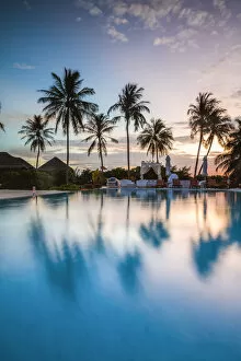 Images Dated 12th February 2018: Palms reflecting in swimming pool at sunset, Maldives