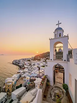 Panagia Spiliani, Blessed Virgin Mary of the Cave Monastery, Bell Tower and Mandraki Town at sunrise, Nisyros Island, Dodecanese, Greece